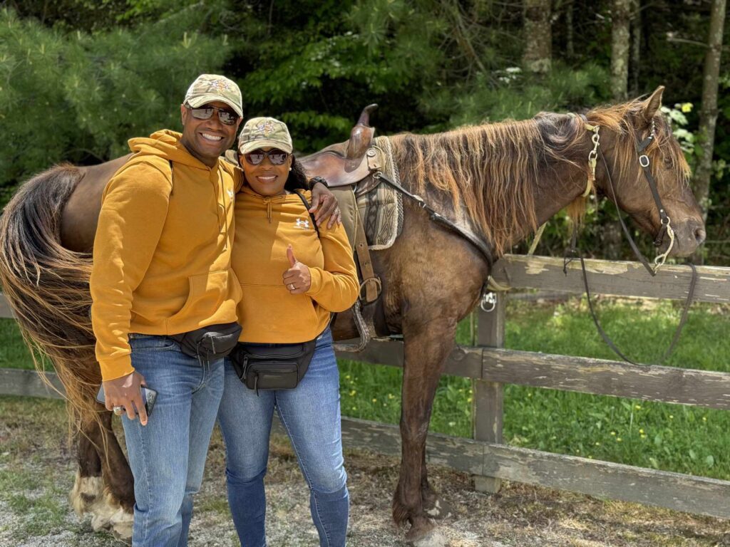 Special Operations Forces Military family, standing next to a horse on an Operation Healing Forces retreat