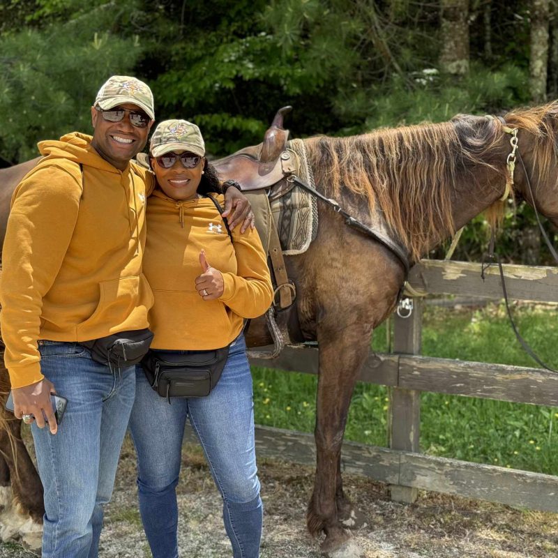 Special Operations Forces Military family, standing next to a horse on an Operation Healing Forces retreat